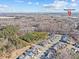 Aerial view of houses and community amenities, including a shopping area at 7145 Hanging Rock Ct, Denver, NC 28037