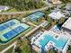 Aerial view showing tennis courts, pools, and clubhouse at 7145 Hanging Rock Ct, Denver, NC 28037