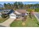 Single-story home with a landscaped yard and two-car garage at 7145 Hanging Rock Ct, Denver, NC 28037