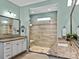 Elegant bathroom with granite countertops, large shower, and updated fixtures at 7145 Hanging Rock Ct, Denver, NC 28037