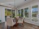 Bright dining room with hardwood floors and plantation shutters at 7145 Hanging Rock Ct, Denver, NC 28037