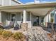 Brick columns and a stone patio enhance this charming front porch at 7145 Hanging Rock Ct, Denver, NC 28037