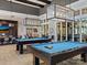 Community clubhouse game room with two pool tables at 7145 Hanging Rock Ct, Denver, NC 28037