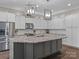 Large kitchen island with granite countertop and seating at 7145 Hanging Rock Ct, Denver, NC 28037