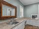 Functional laundry room with granite countertops and built-in storage at 7145 Hanging Rock Ct, Denver, NC 28037