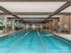 Indoor lap pool with lane lines in a community clubhouse at 7145 Hanging Rock Ct, Denver, NC 28037