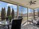 Screened porch with seating area and view of neighborhood at 7145 Hanging Rock Ct, Denver, NC 28037