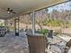 Screened porch with patio furniture and wooded views at 7145 Hanging Rock Ct, Denver, NC 28037