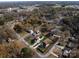 Aerial view showcasing two houses with a pool, nestled in a residential neighborhood at 719 Greenbriar Dr, Matthews, NC 28104