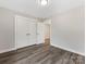 Spacious bedroom with hardwood floors and double door closet at 719 Greenbriar Dr, Matthews, NC 28104