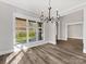 Elegant dining room with hardwood floors and large window at 719 Greenbriar Dr, Matthews, NC 28104