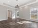 Spacious dining room with hardwood floors and a chandelier at 719 Greenbriar Dr, Matthews, NC 28104