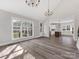 Bright dining room with kitchen view and large window at 719 Greenbriar Dr, Matthews, NC 28104