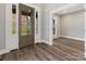 Bright entryway with hardwood floors and view into an adjacent room at 719 Greenbriar Dr, Matthews, NC 28104