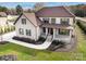 Two-story house with brick facade, brown roof, and landscaped lawn at 719 Greenbriar Dr, Matthews, NC 28104