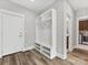 Mudroom with built-in bench, shelving and coat hooks at 719 Greenbriar Dr, Matthews, NC 28104