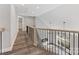 Open upper hallway overlooking the living room at 719 Greenbriar Dr, Matthews, NC 28104