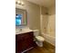 Clean bathroom with a vanity, toilet, and shower/tub combination at 104 Lassiter Ct, Mount Holly, NC 28120