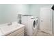 Convenient laundry room with washer, dryer, and utility sink at 1057 Princeton Dr, Indian Land, SC 29707