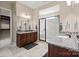 Elegant bathroom with double vanity, granite countertops, and a large walk-in shower at 1132 Cades Ct, Denver, NC 28037