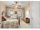 Bright bedroom with two twin beds and a ceiling fan at 1132 Cades Ct, Denver, NC 28037