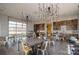 Bright community room with tables, chairs, and modern light fixtures at 1132 Cades Ct, Denver, NC 28037