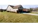 Side view of house with attached garage and landscaping at 1132 Cades Ct, Denver, NC 28037