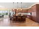 Spacious kitchen with island, stainless steel appliances, and hardwood floors at 1132 Cades Ct, Denver, NC 28037