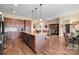 Eat-in kitchen with an island, hardwood floors and stainless steel appliances at 1132 Cades Ct, Denver, NC 28037