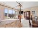 Large bedroom with a four-poster bed, ample closet space, and views of the backyard at 1132 Cades Ct, Denver, NC 28037