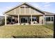 Covered patio with seating area and outdoor lighting at 1132 Cades Ct, Denver, NC 28037