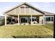 Covered patio with seating area, ideal for outdoor relaxation at 1132 Cades Ct, Denver, NC 28037