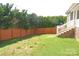 Well-maintained backyard with a neat wooden fence, offering privacy and a space for gardening at 118 Cypress Acres Ln, Statesville, NC 28625