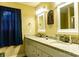 Double vanity bathroom with granite countertops and decorative mirrors at 118 Cypress Acres Ln, Statesville, NC 28625