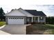 Charming single Gathering home with a two car garage, covered porch, and manicured lawn at 118 Cypress Acres Ln, Statesville, NC 28625