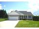 Charming single-story home featuring a two-car garage, well-maintained lawn and inviting front porch at 118 Cypress Acres Ln, Statesville, NC 28625