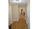 Hallway with wood floors and white trim leading to the living room at 118 Cypress Acres Ln, Statesville, NC 28625