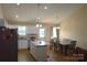 Eat-in kitchen with white cabinets, granite countertops, and stainless steel appliances at 118 Cypress Acres Ln, Statesville, NC 28625