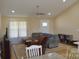 Cozy living room with lots of seating, natural light and ceiling fan at 118 Cypress Acres Ln, Statesville, NC 28625