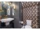 Chic powder room with dark vanity and floral wallpaper at 1844 Giana Ln, Monroe, NC 28112