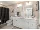 Modern bathroom with double vanity and white cabinets at 1844 Giana Ln, Monroe, NC 28112