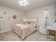 Cozy bedroom with a queen-size bed and neutral decor at 1844 Giana Ln, Monroe, NC 28112