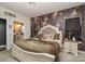 Elegant main bedroom with floral accent wall and plush bedding at 1844 Giana Ln, Monroe, NC 28112