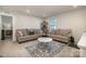 Bright bonus room with two sofas and a cat tree at 1844 Giana Ln, Monroe, NC 28112