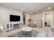 Open bonus room with TV, fireplace, and staircase at 1844 Giana Ln, Monroe, NC 28112