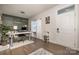 Bright home office with desk, shelving, and wood floors at 1844 Giana Ln, Monroe, NC 28112