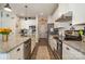 Bright kitchen boasts stainless steel appliances and granite countertops at 1844 Giana Ln, Monroe, NC 28112