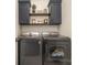 Convenient laundry room with washer, dryer, and cabinets at 1844 Giana Ln, Monroe, NC 28112