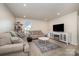 Cozy living area featuring comfortable sofas and electric fireplace at 1844 Giana Ln, Monroe, NC 28112
