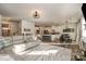 Open living room and kitchen with sectional sofa and large island at 1844 Giana Ln, Monroe, NC 28112